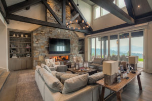 Modern living room with stone fireplace.