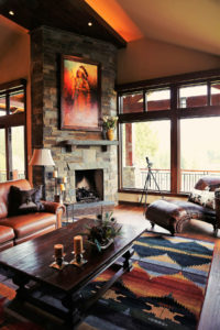 Rustic living room with stone fireplace.
