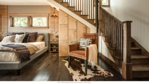 HGTV Blog Cabin 2015 Cozy bedroom under staircase with modern decor.