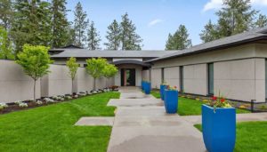Modern home with garden and blue planters