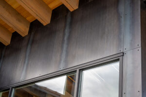 Steel Cladding and Wood Beam Architecture