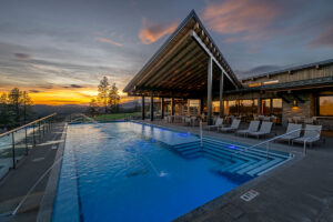 Luxury infinity pool at sunset view resort.