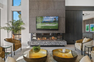 Black Rock Residence #6 Modern living room with fireplace and TV display.