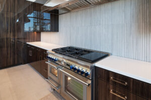 Black Rock Residence #6 Luxury kitchen with modern stainless stove.