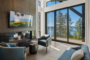 Black Rock Residence #6 Modern living room with lake view and TV.
