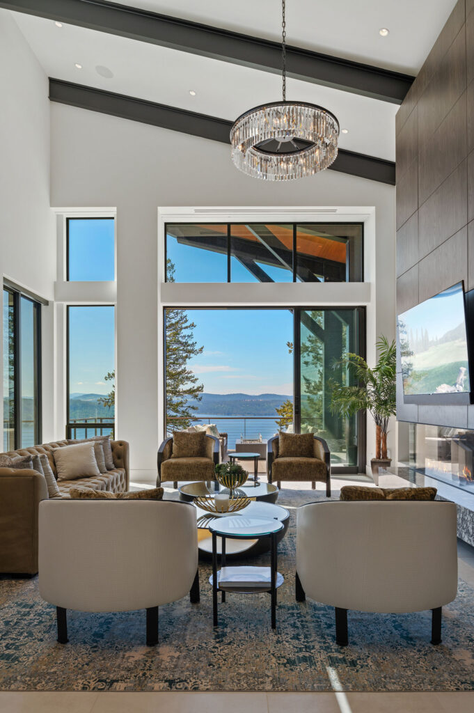 Modern living room with lake view and stylish decor.
