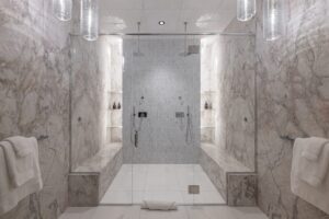 Black Rock Residence #7 Marble walk-in shower with dual shower heads and built-in benches